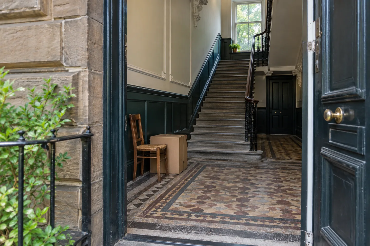 Illustrative Glasgow tenement entrance showing the shared close and stairs